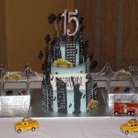 Music In The City Red Velvet, WASC and Chocolate cake with buttercream. Gumpaste Buildings and taxis