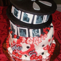 Movie Reel Engagement Cake This was a cake for a rehearsal dinner. The colors were red, black, and white...with a heart theme. They wanted to incorporate their...