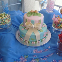 Twins Baby Shower I was given a picture of this cake by the mom of the twins. Not sure who the original designer is. Bottom is a yellow cake with vanilla...