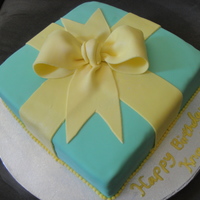 Gift Box Birthday Cake This is a 10" square butter cake with nuts and a vanilla custard filling. Covered and decorated with MMF.