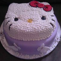 Hello Kitty Hello Kitty cake for my niece's 4th birthday. Bottom is a white cake with white chocolate ganache and berries, top is a coconut cake...