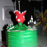 Super Mario This cake was designed by my son, for his birthday.It was made with small 3inch round white cakes, triple stacked.Cream cheese icing on...