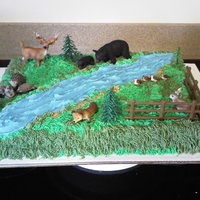 Wilderness Cake BC sheet cake with animals the mom bought for her daughter!