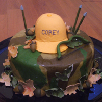 Archery Hunting Birthday Cake This is a cake I did for my hairdressers husbands birthday. The hat and arrows are made out of gum paste, the leaves and acorns are fondant...