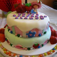 Strawberry Shortcake Marshmallow fondant, buttercream icing and various candies including sixlets