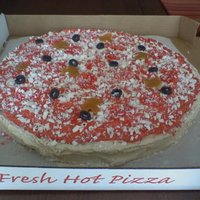 Pizza Cake Buttercream icing caramel mushrooms, gum drop black olives, white chocolate cheese, fruit rollup pepperoni