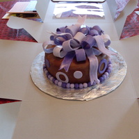 Chocolate And Purple Birthday Cake Yellow cake with chocolate buttercream and chocolate MMF. She loves purple, so I finished it with a MMF bow and accents. Enjoy!