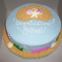 Beach Cake Yellow cake, MMF, and buttercream. I made this cake for a friend at my husbands office who was having a ocean themed wedding.