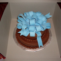 Fondant Bow And Chocolate Fondant Cake Yellow cake with chocolate buttercream and chocolate marshmellow fondant. First fondant bow. I am now a bow fanatic!