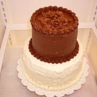 40Th Anniversary Cake The top is a 6 inch German chocolate with chocolate buttercream roses. The bottom is an 8 inch carrot cake with cream cheese frosting. This...