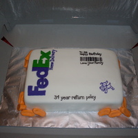 Fedex Birthday Cake Yellow cake with buttercream icing and Rhonda's MMF. This was my first time working with fondant and I loved it.!