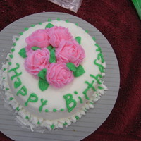 Rose Cake First Cake made during Wilton Class. Didn't clean the base.
