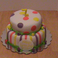 Polka Dots And Stripes Basic cake...just polka dots and stripes. The flowers are just ribbon flowers.