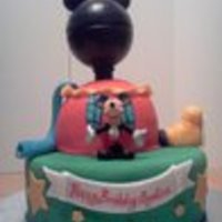 Mickey Mouse Club House The base is a 12 in round covered in fondant. On top is the half ball cake. I wanted to have the Mickey head be cake but that wasnt...