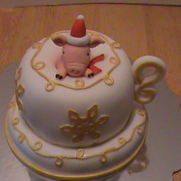 Piggie In A Tea Cup Three 8 in. cakes stacked and carved to make the cup's shape. The saucer is a 8 in. round. All covered in fondant. The piggie is a...