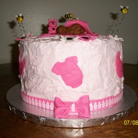 Baby Shower With First Impressions Baby Mold buttercream with fondant accents and baby bottle ribbon. first impressions baby mold(love this mold) and onesies and bib cutters