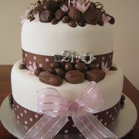 Chocolates For A 21St I made this for my daughters 21st. 2 Tier chocolate cake covered in fondant and decorated with many delicious chocolates.