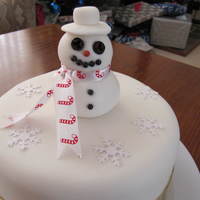 Christmas Snowman I have made this cake for my mum for Christmas. It is the first time I have had a try at modelling fondant. He turned out rather cute!