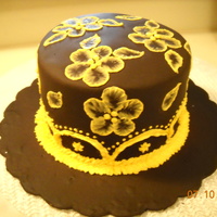 Brown And Yellow Brushed Embroidery This was practice on something I hadn't done since I did it in class...brushed embroidery. Also practicing piping. The fondant is the...