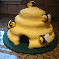 Busy Bees Fondant covered with modelling paste bees. It's a Debbie Brown cake. My first fondant covered attempt.