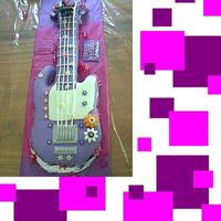 Hannah Montana Guitar Cake this is a yellow cake with vanilla butter cream for a 5th birthday party. its what i envisioned miley cyrus's guitar to be.