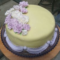 Yellow And Lilac Carnation Cake Cake is covered in MMF, flowers and drapes are 50/50. It did say "Happy Birthday" on it when it was completely done, but I forgot...