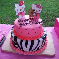 Hello Kitty Cake This was for my daughter's 5th birthday! Bottom tier is yellow cake with chocolate ganache, chocolate bc filling. Top tier is WASC...