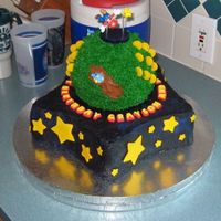 Super Mario Galaxy Birthday cake for two brothers, 9 and 10. It's my version of the Mario Galaxy cake by DC0630. Base was made with Wilton star pan with...