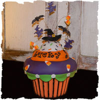 Spooktacular Cupcake Made this for a halloween themed jewelry party. Bottomwrapper is chocolate melts and top is sculpted rice crispy treats decorated with...