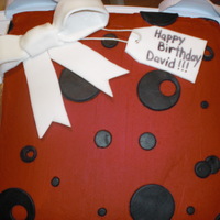 Birthday Gift Cake This was my first gift cake and first time doing a fondant bow. It's yellow cake with a rich chocolate filling, red buttercream with...