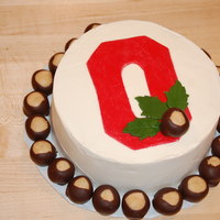 Ohio State Birthday Cake White cake with strawberry filling. Frosted in buttercream, fondant decorations on top. 35 real buckeyes (not fondant) for the birthday boy...