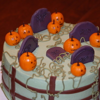 Halloween Graveyard This was a fun cake to make! Pumpkin Spice Cake with Caramel Mousse Filling. Iced in buttercream, with fondant pumpkins and gravestones....