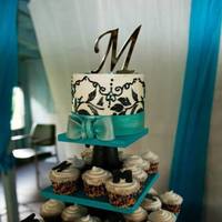 Flame Calla Lily Wedding Cake *6" round cake topper made of buttercream icing. Used a stencil to do the floral design and hand piped the swirls. Bow is made out of...