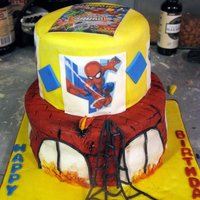 Super Hero Squad Cake for 30. Superhero Squad. Hot Cocoa cake with Indydebi buttercream under MMF. Edible images. I wanted the building (bottom tier) to...