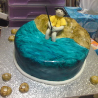 Fisherman Cake chocolate mudcake covered in painted fondant with a gumpaste fisherman - my first attempt at making a person