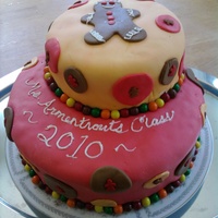 Gingerbread Cake A cake I made for my daughters Kindergarten class. Really fun to make, I used Sixlets as the borders.