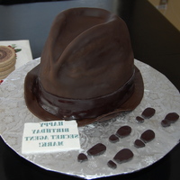 Spy Cake Spy Cake - carved from 3 - 9" cakes made of dark chocolate cake. Covered in fondantEdible image message printed backwardsFootprints...