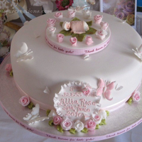 Christening Cake Lemon Sponge with white chocolate and apricot filling.................cake for Lillia Rose, hence all the roses and the little baby...
