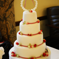 Strawberry Summer Fondant cake with hand made strawberries and daisies.