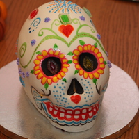 Day Of The Dead Skull This is a day of the dead skull cake modeled after the sugar skulls that they make. It is a red velvet cake with buttercream frosting. It...