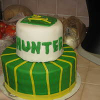 Nephew's First Birthday This is for my nephew's first birthday John Deere theme. On the bottom tier it is yellow cake with BC icing and the top tier is...