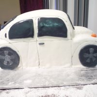 Vw Bug devils food cake with bc. mm fondant covering and decorations.