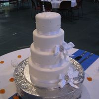 Cotillion Events Wedding Cakes Cincinnati Oh Round White Cake Wedding Cake in Cincinnati OH. White fondant and satin ribbon.