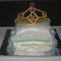 Tiara Cake For A 30Th Birthday Party Darn Good Chocolate Cake, Covered in MMF. Sprayed with pearl. The tiara was made out of gumpaste and then sprayed with gold.