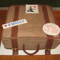 Suitcase A chocolate cake covered in chocolate buttercream with fondant accents. Stickers made out of gumpaste. It was fun to make and the birthday...