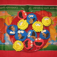 Sesame Street Cupcakes Sesame Street Cupcakes and WASC cake. Iced with buttercream. Oreo cookies for the mouth.