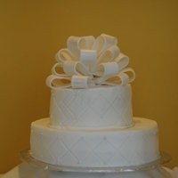 Annviersary Cake WASC with fondant bow. First time using an impression mat. Second time making a bow and this one was so much better.