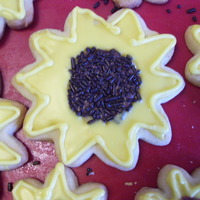 Sunflowers this is a cream cheese cut out cookie with royal icing I got off of you tube. There is a farm where I live and they always plant sunflowers...