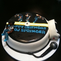 Dj Cake This cake was made for a DJ. The client requested a vinyl with pictures od him and his favorite Dr Dre headphones.