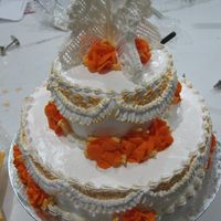 My First Wedding Cake Chiffon cake and boiled icing. I made the wings( Strings and scroll top) and the roses (made from royal icing)